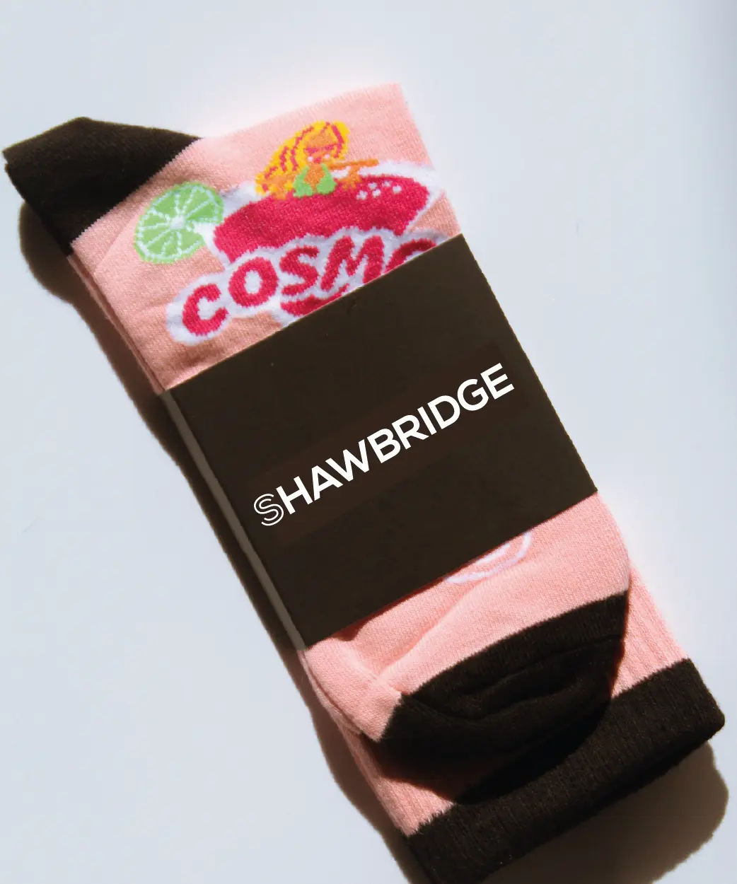des bas rose aux couleurs du cocktail signature de Shawbridge le Cosmo